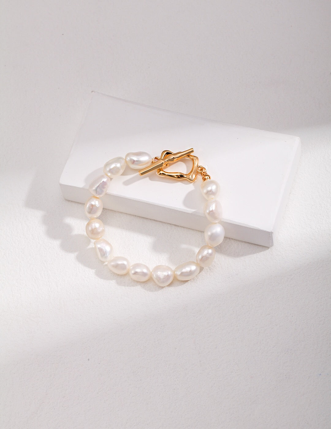A stunning Chunky Baroque Pearl Bracelet featuring natural freshwater pearls and gold vermeil, showcasing unique irregular shapes.