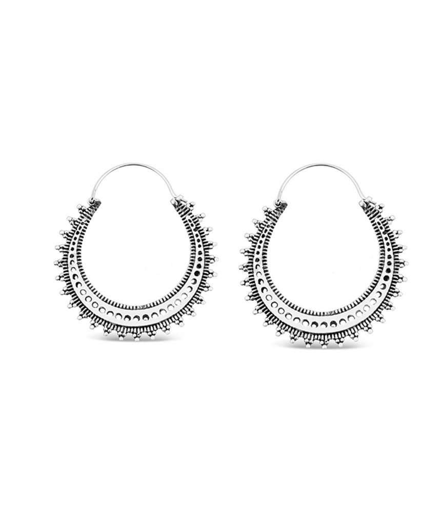 A pair of elegant Circular Boho Hoop Earrings made from brass and silver, featuring a classic hoop design suitable for sensitive skin.