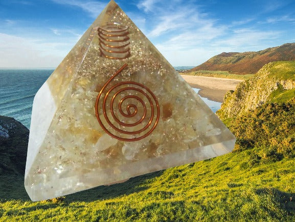 Citrine Orgone Pyramid featuring natural citrine and clear quartz with copper spirals, designed for prosperity and energy cleansing.