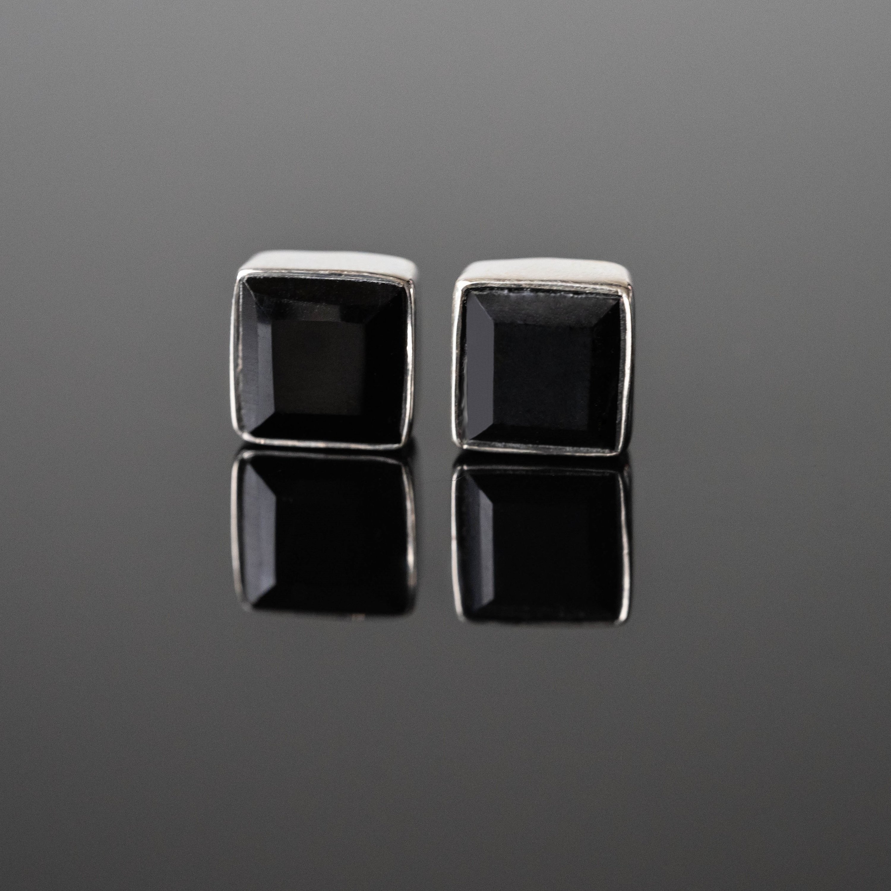 Clara Black Onyx Square Studs made of 925 sterling silver with rhodium plating, featuring 8 mm black onyx stones, elegantly displayed in gift-ready packaging.