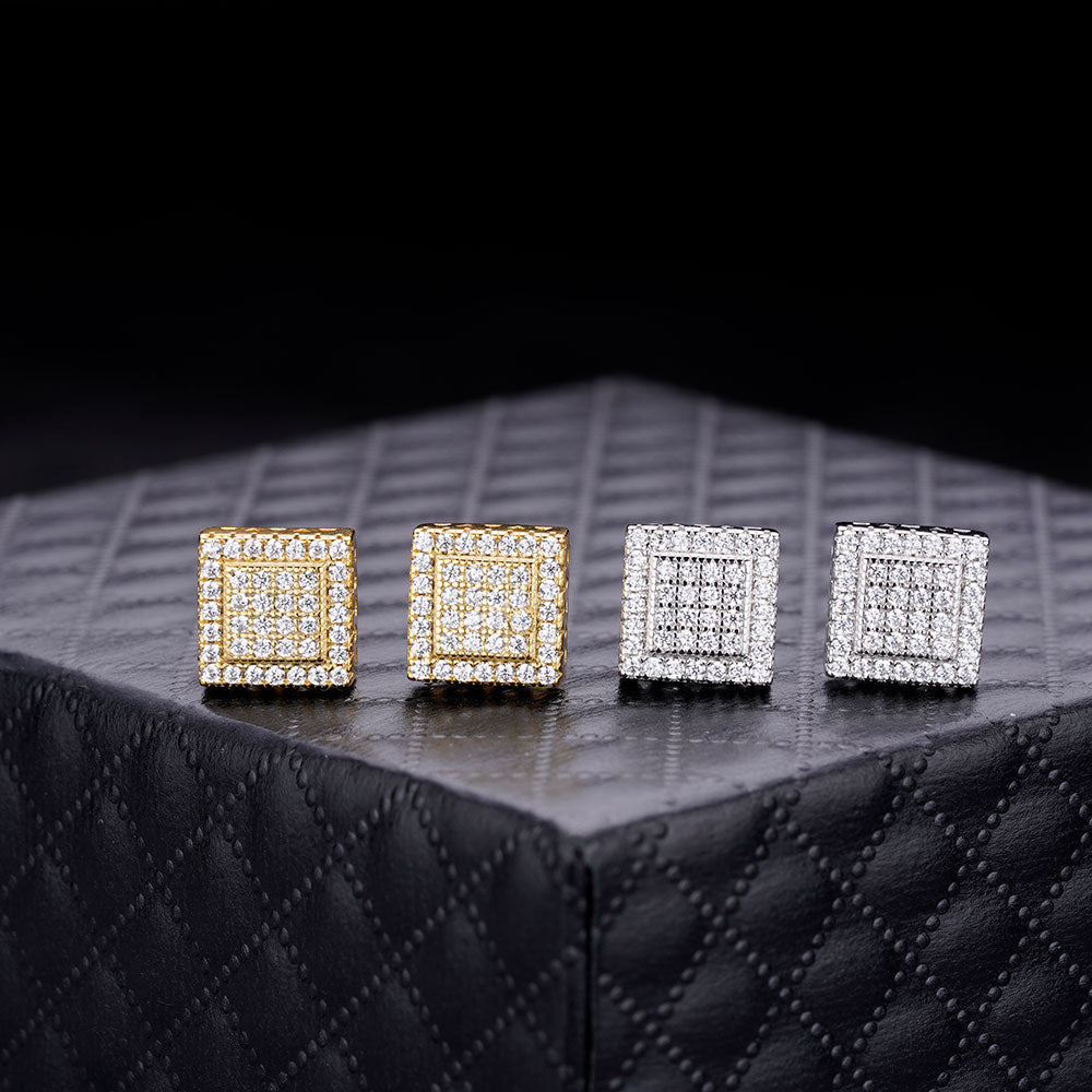 A pair of elegant CLARUS sterling silver earrings featuring cubic zircon stones, designed as screw back studs with a square shape.