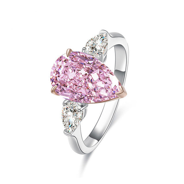 Classic sterling silver ring with white sapphire and pear-shaped pink cz, showcasing elegance and sparkle.