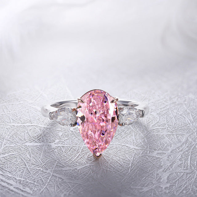 Classic sterling silver ring with white sapphire and pear-shaped pink cz, showcasing elegance and sparkle.