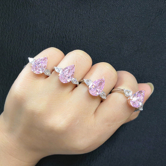 Classic sterling silver ring with white sapphire and pear-shaped pink cz, showcasing elegance and sparkle.