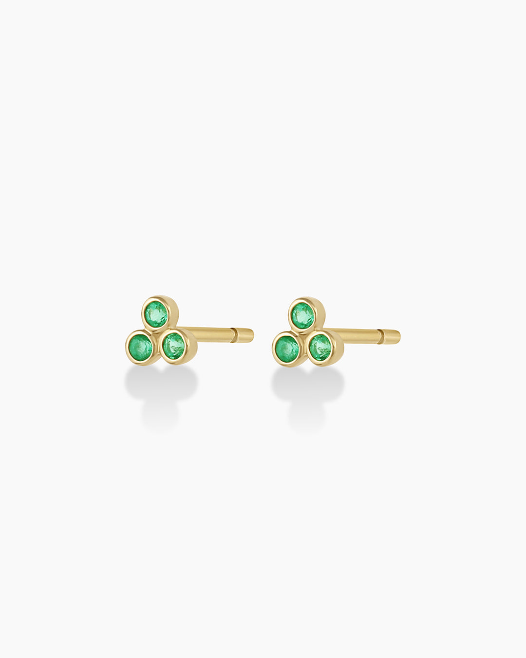 Classic Emerald Trio Studs featuring three vibrant emerald stones set in elegant design.
