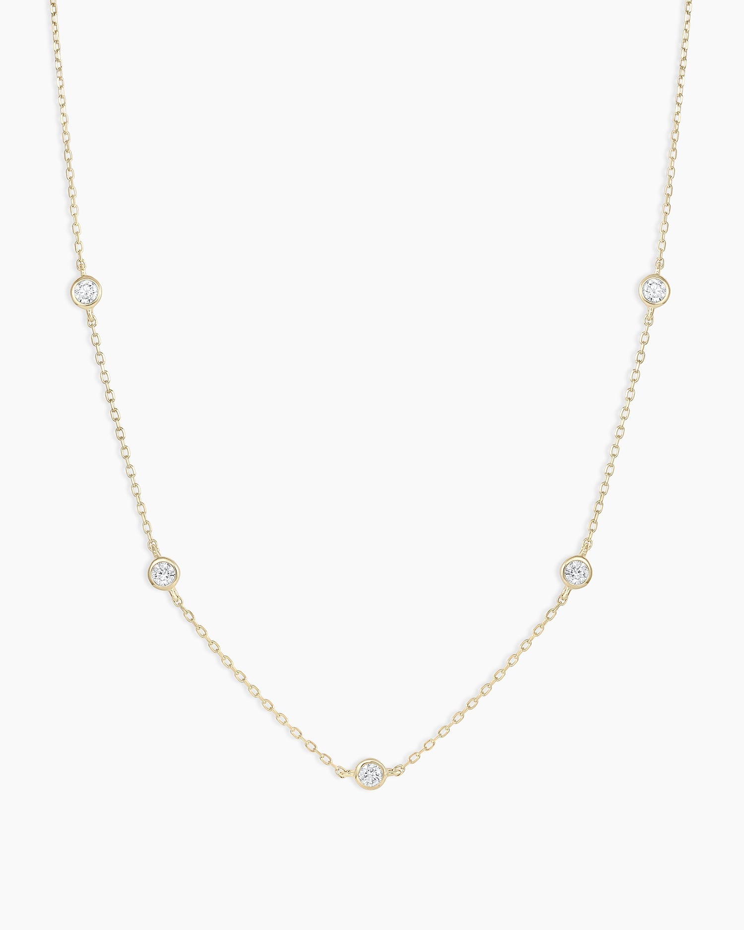 A classic five diamond necklace featuring five sparkling lab-grown diamonds set in a delicate metal chain, showcasing elegance and sophistication.