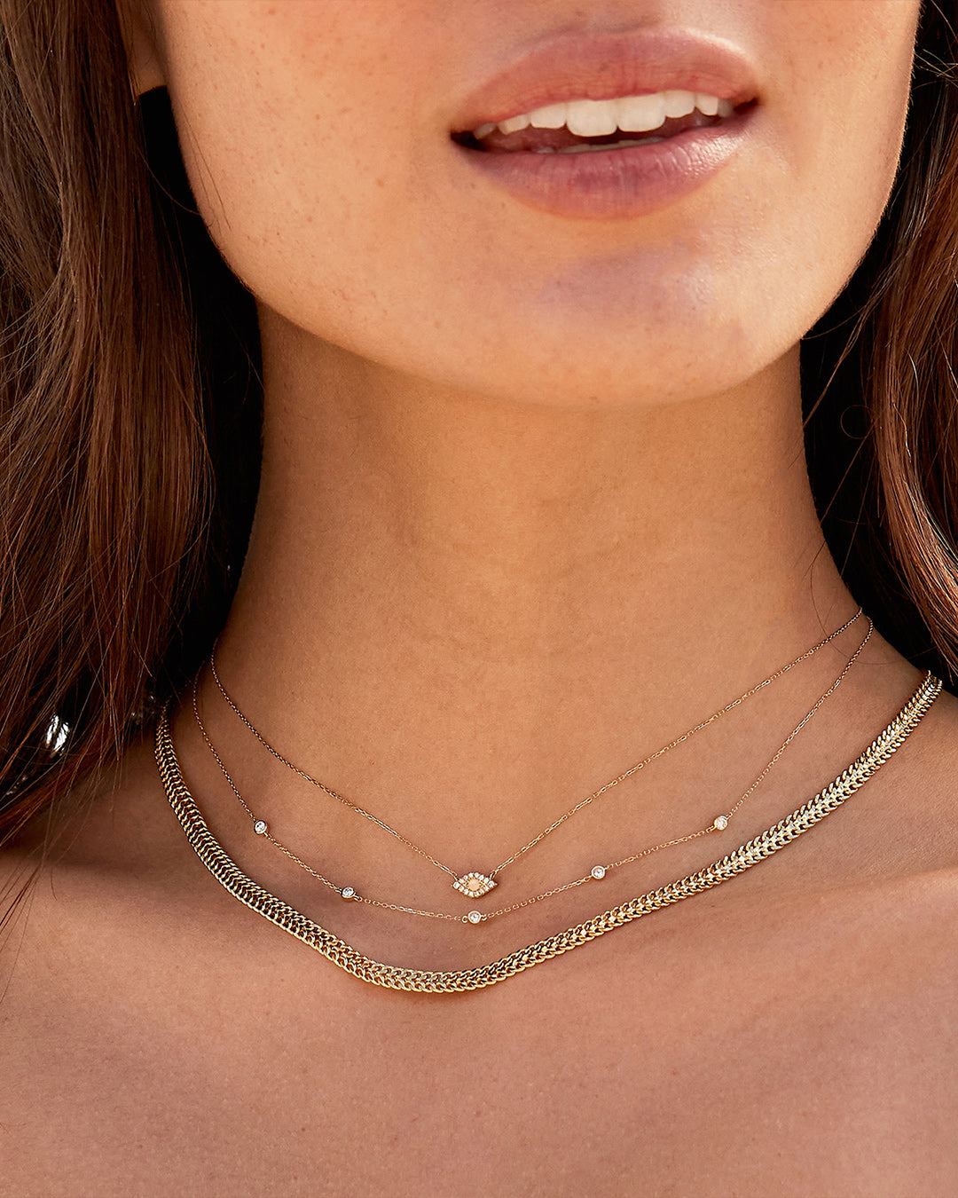 A classic five diamond necklace featuring five sparkling lab-grown diamonds set in a delicate metal chain, showcasing elegance and sophistication.