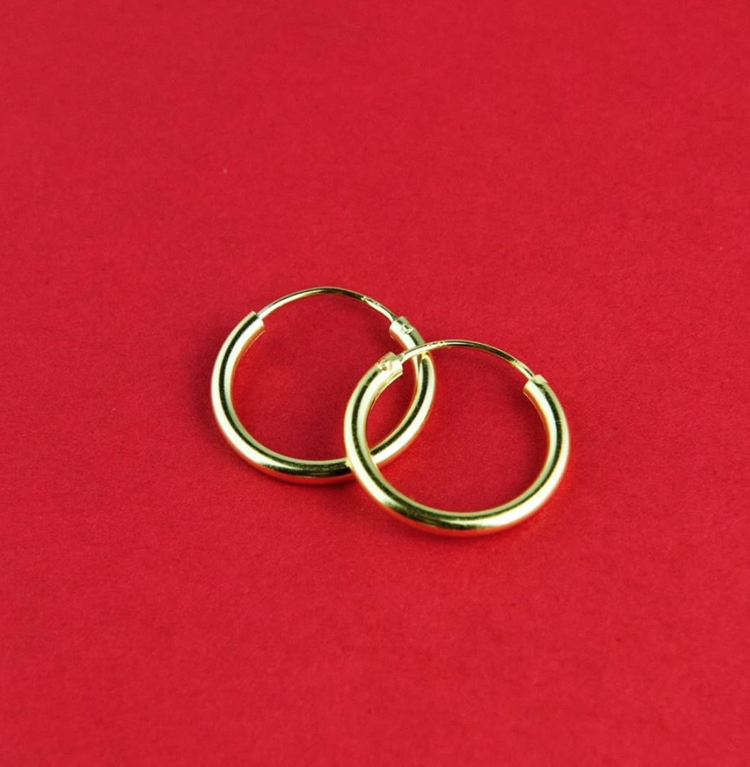 Classic Gold Hoop earrings made of sterling silver with 18k gold plating, showcasing a timeless and elegant design.