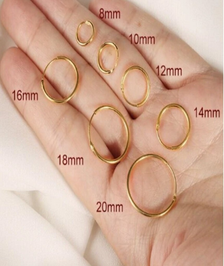 Classic Gold Hoop earrings made of sterling silver with 18k gold plating, showcasing a timeless and elegant design.