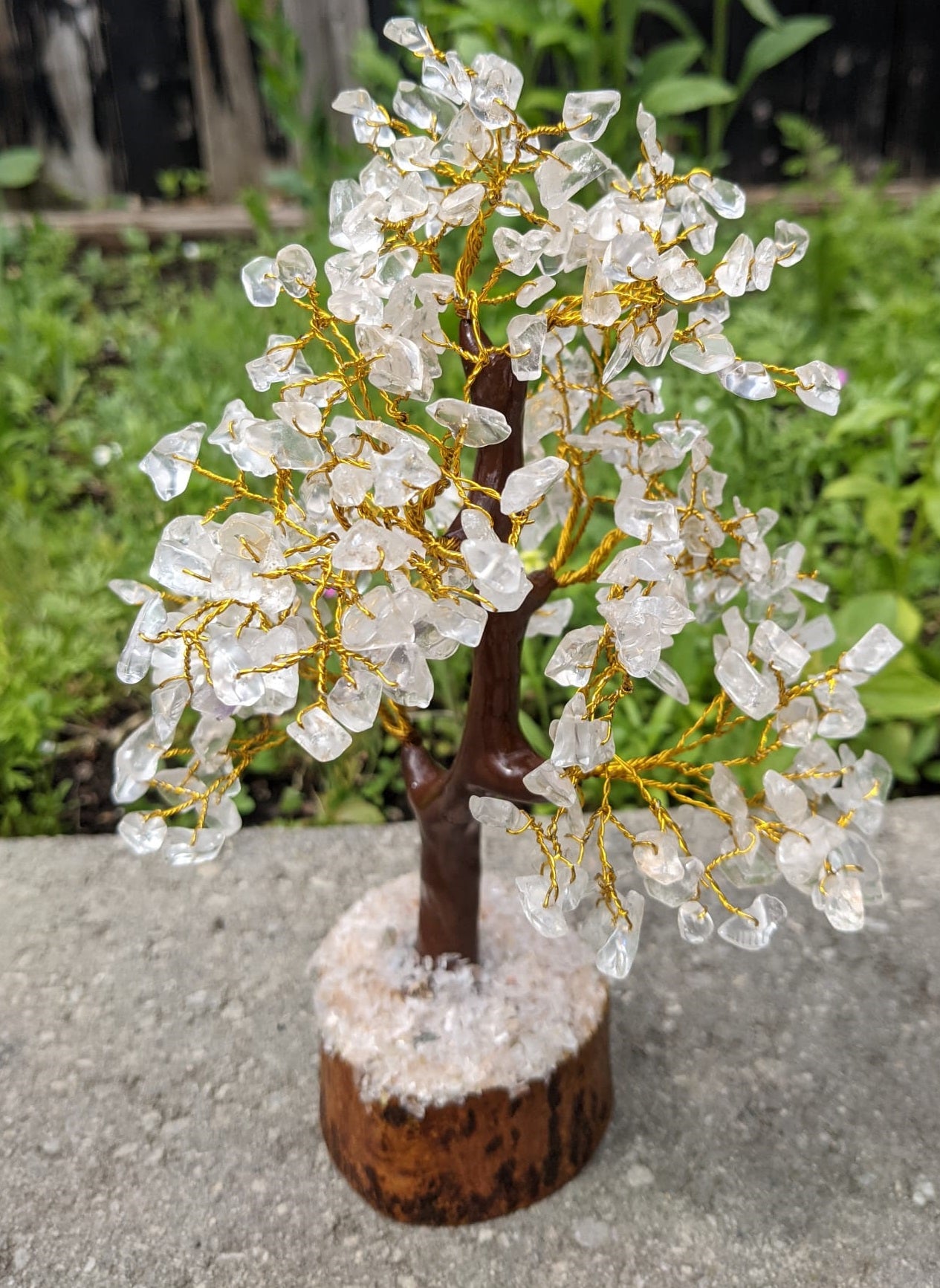 A beautifully handcrafted Clear Quartz Gemstone Tree featuring 300 natural quartz chips on a sturdy wooden base, standing 8-9 inches tall.