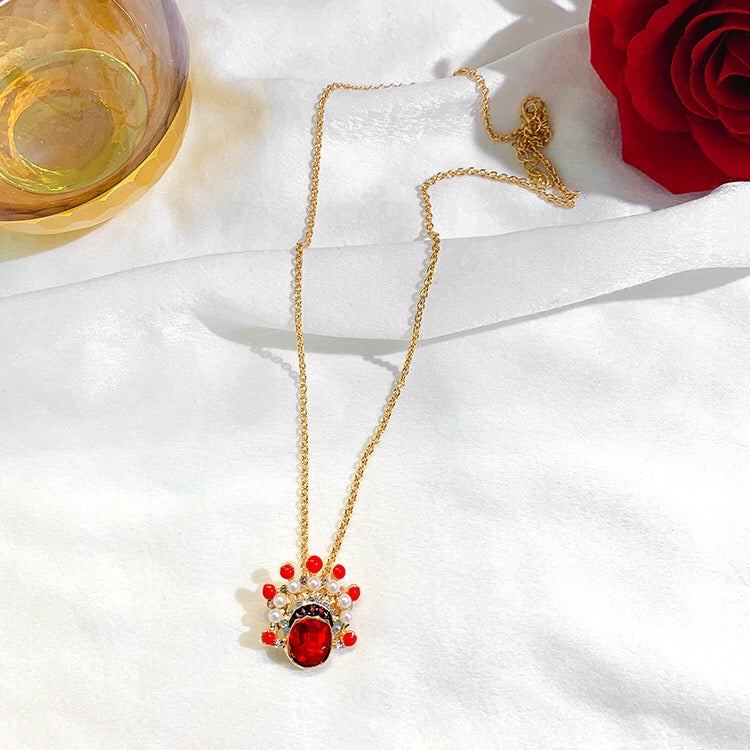 CLNLP Opera Face Necklace featuring alloy and pearl materials with a unique charm design.