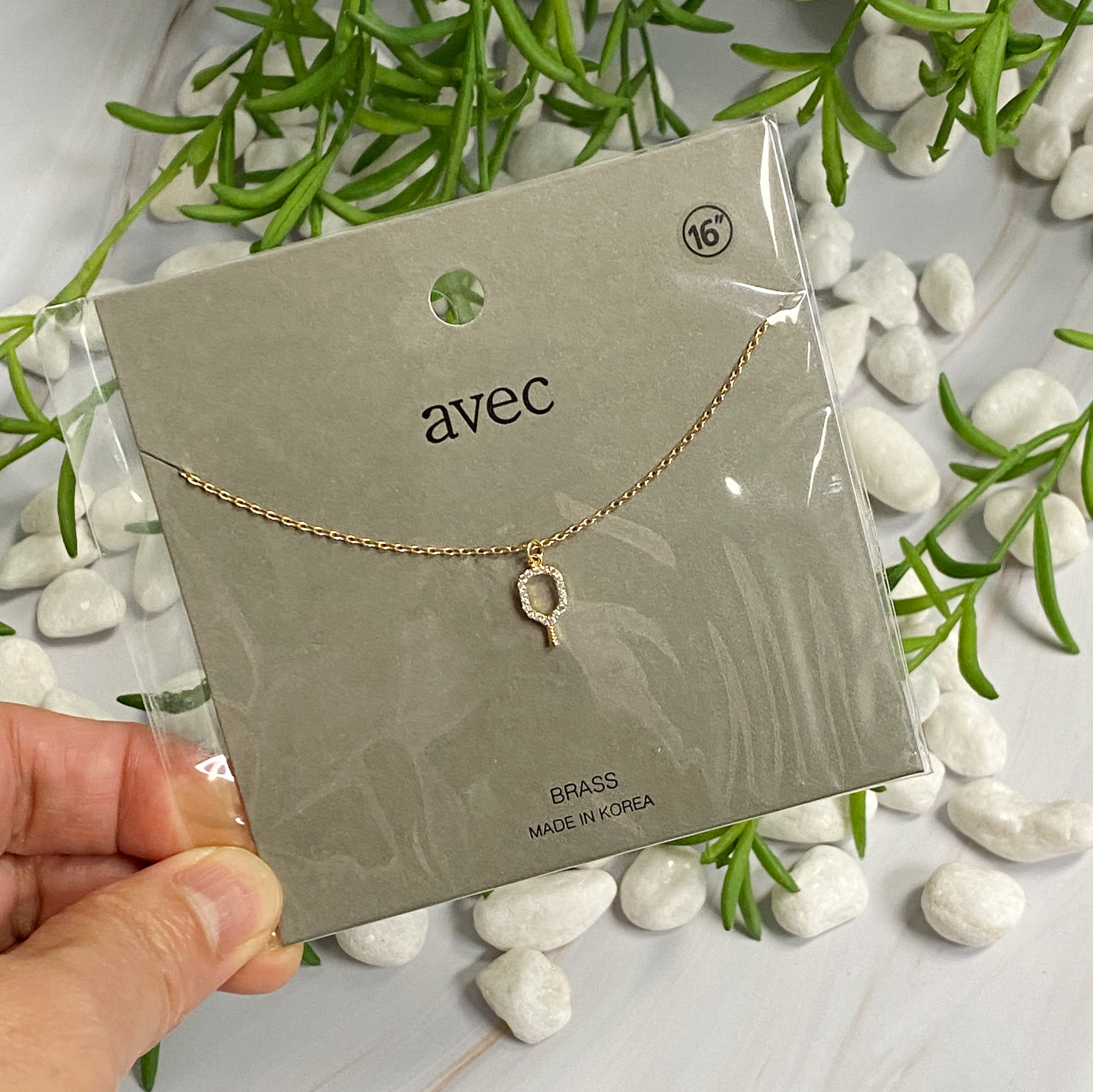 A delicate gold plated brass necklace featuring a pickleball racket outline, perfect for pickleball enthusiasts.