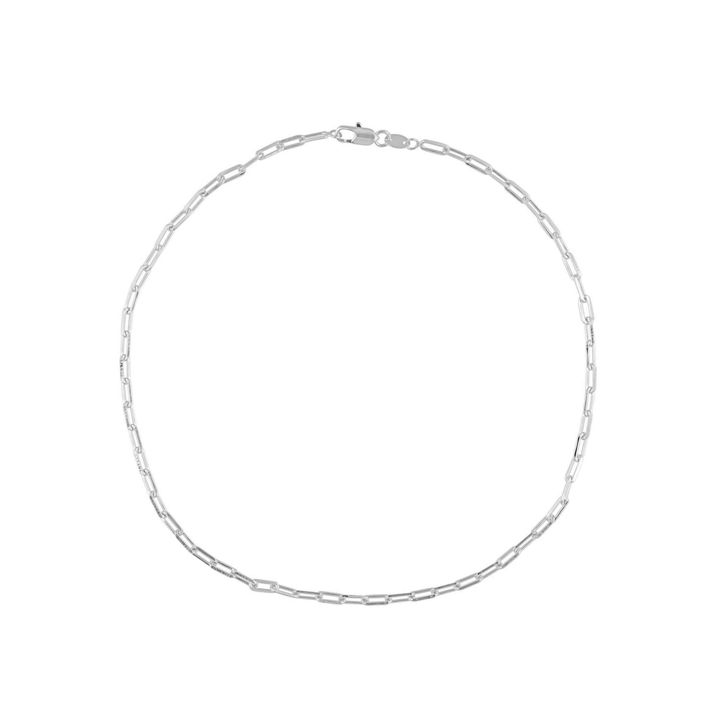 A delicate silver link necklace, perfect for layering, featuring dainty links that add shine and elegance to any outfit.