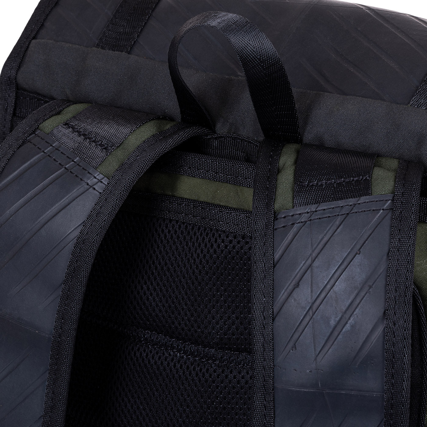 Colonel Vegan Water Resistant Backpack featuring a padded laptop compartment, made from reclaimed materials, showcasing its eco-friendly design.