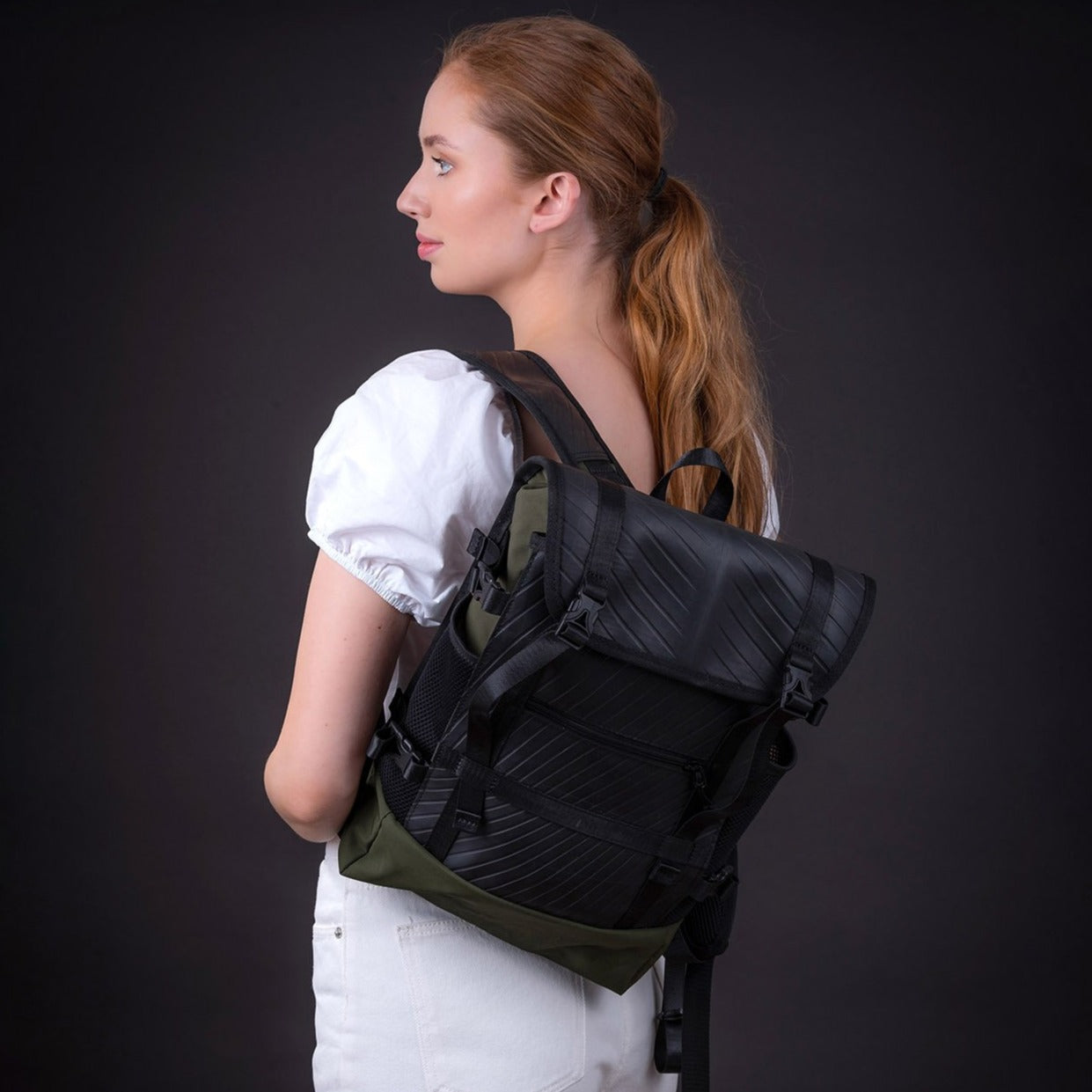 Colonel Vegan Water Resistant Backpack featuring a padded laptop compartment, made from reclaimed materials, showcasing its eco-friendly design.