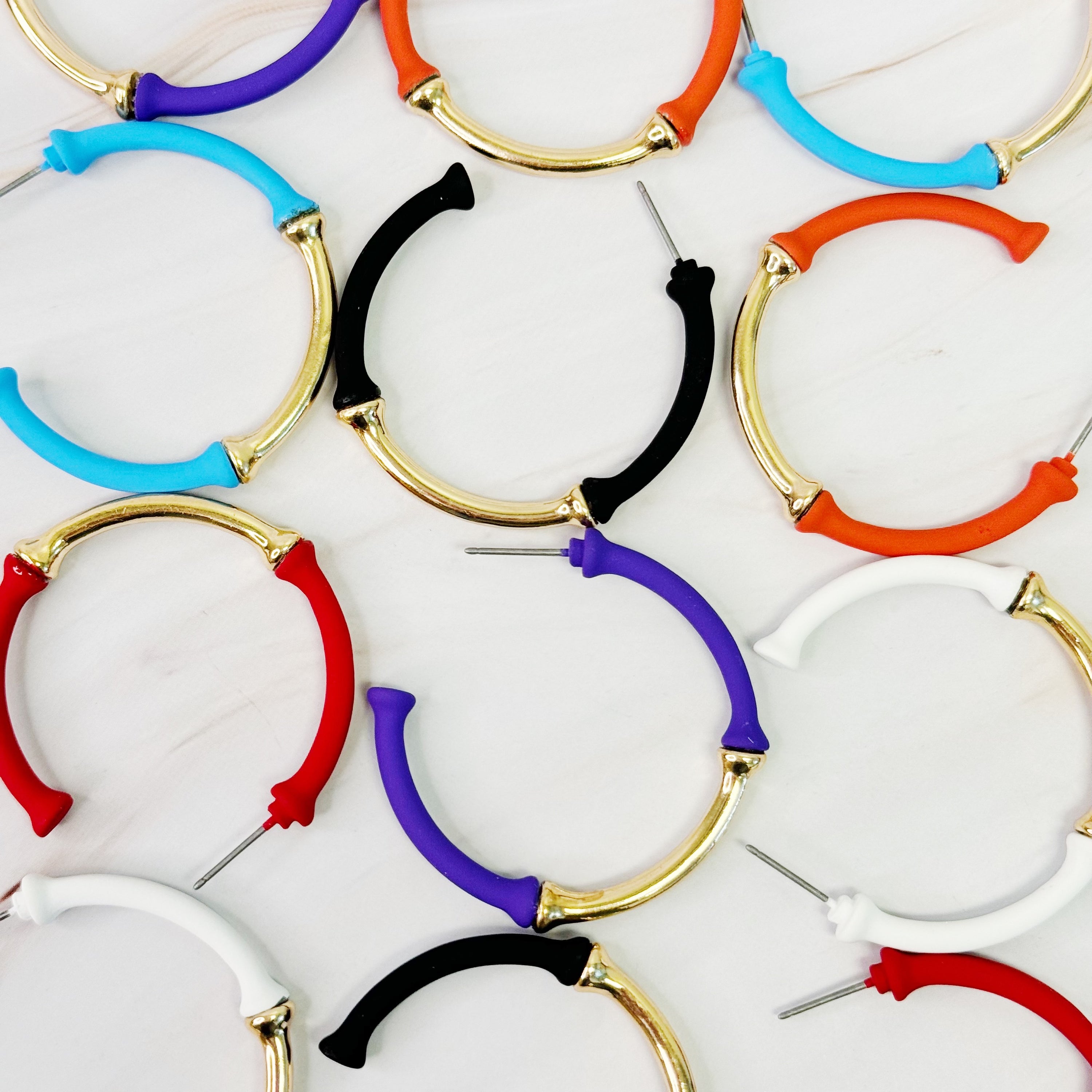 Color Coated Bamboo Hoop Earrings in vibrant colors, showcasing a unique bamboo design and lightweight structure.