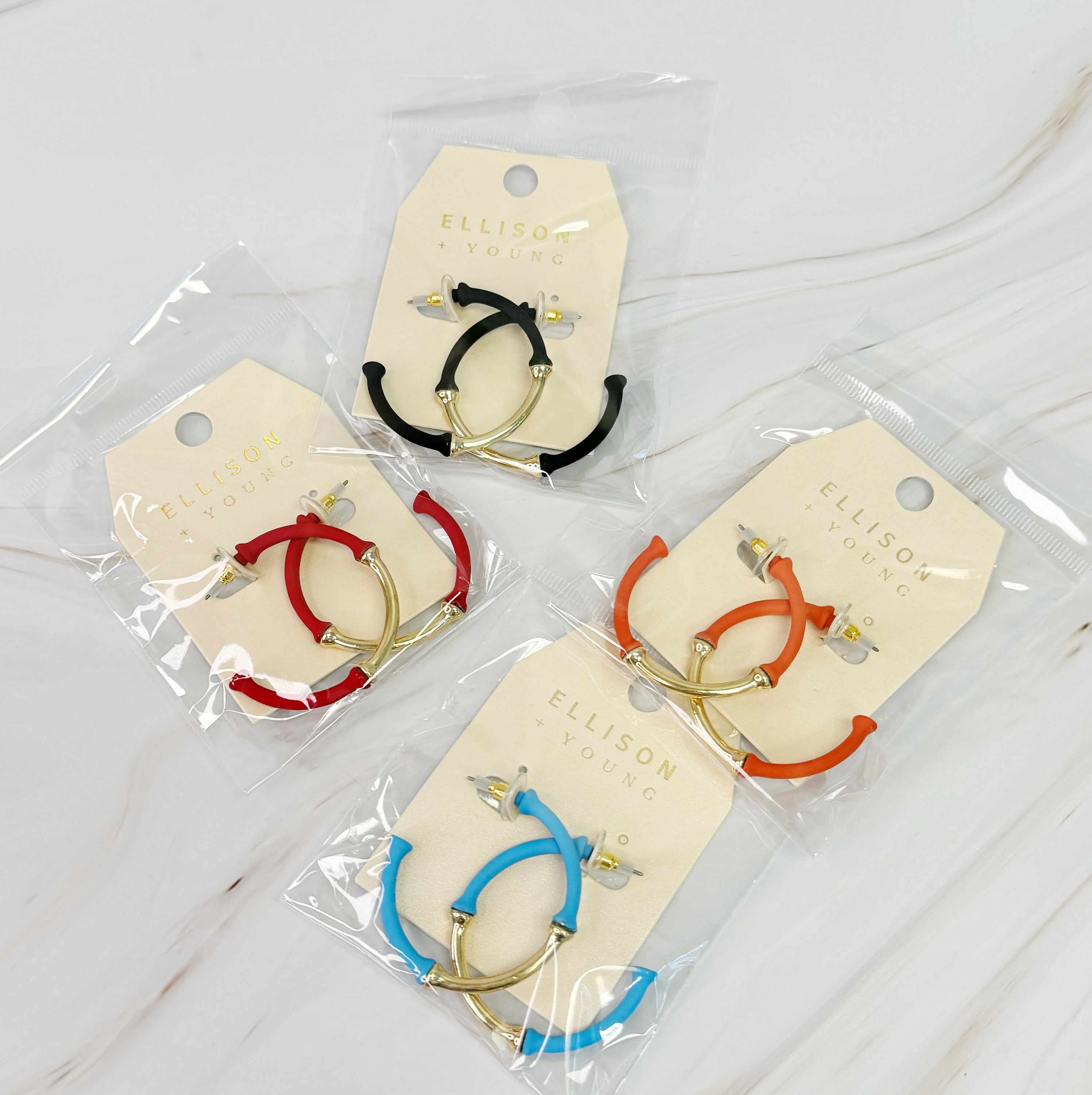 Color Coated Bamboo Hoop Earrings in vibrant colors, showcasing a unique bamboo design and lightweight structure.