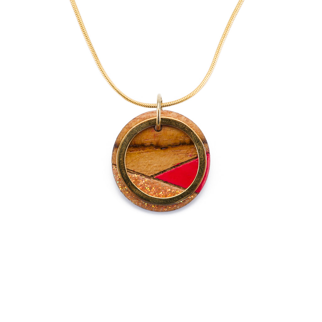 Conture Recycled Wood Gold Chain Necklace featuring a unique wooden pendant and gold plated chain, available in four nature-inspired colors.