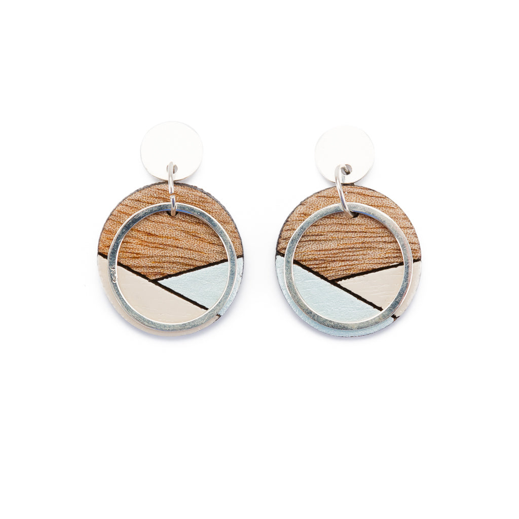 Conture Recycled Wood Silver Earrings showcasing unique wood patterns and sterling silver backing, available in six colors.