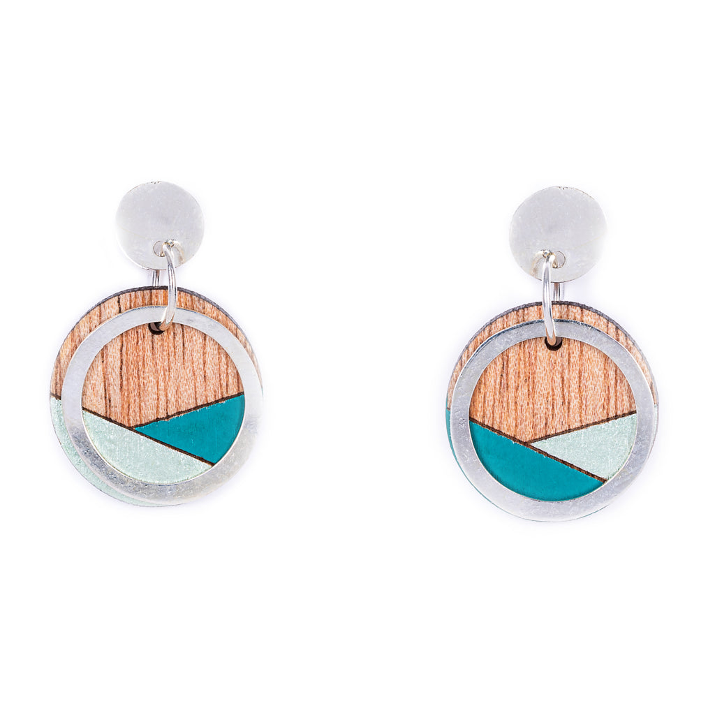 Conture Recycled Wood Silver Earrings showcasing unique wood patterns and sterling silver backing, available in six colors.