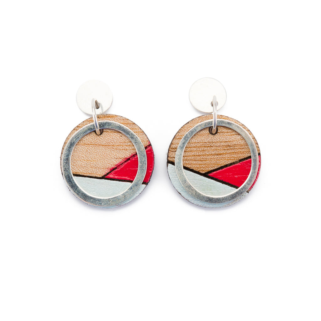 Conture Recycled Wood Silver Earrings showcasing unique wood patterns and sterling silver backing, available in six colors.