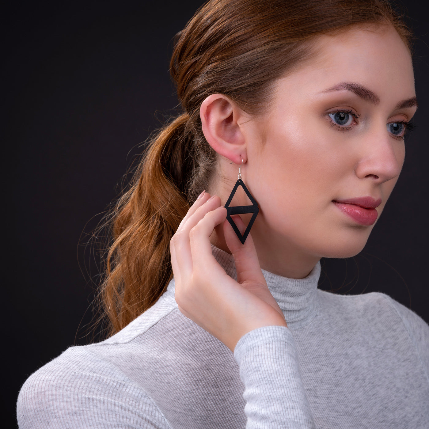 Copenhagen Recycled Rubber Earrings handcrafted from tyre inner tubes, featuring sterling silver hooks and a unique design.