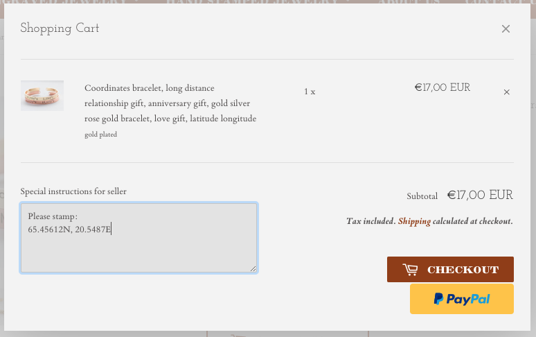 A beautiful adjustable Coordinates bracelet in gold and silver plating, showcasing a unique hand-stamped design.