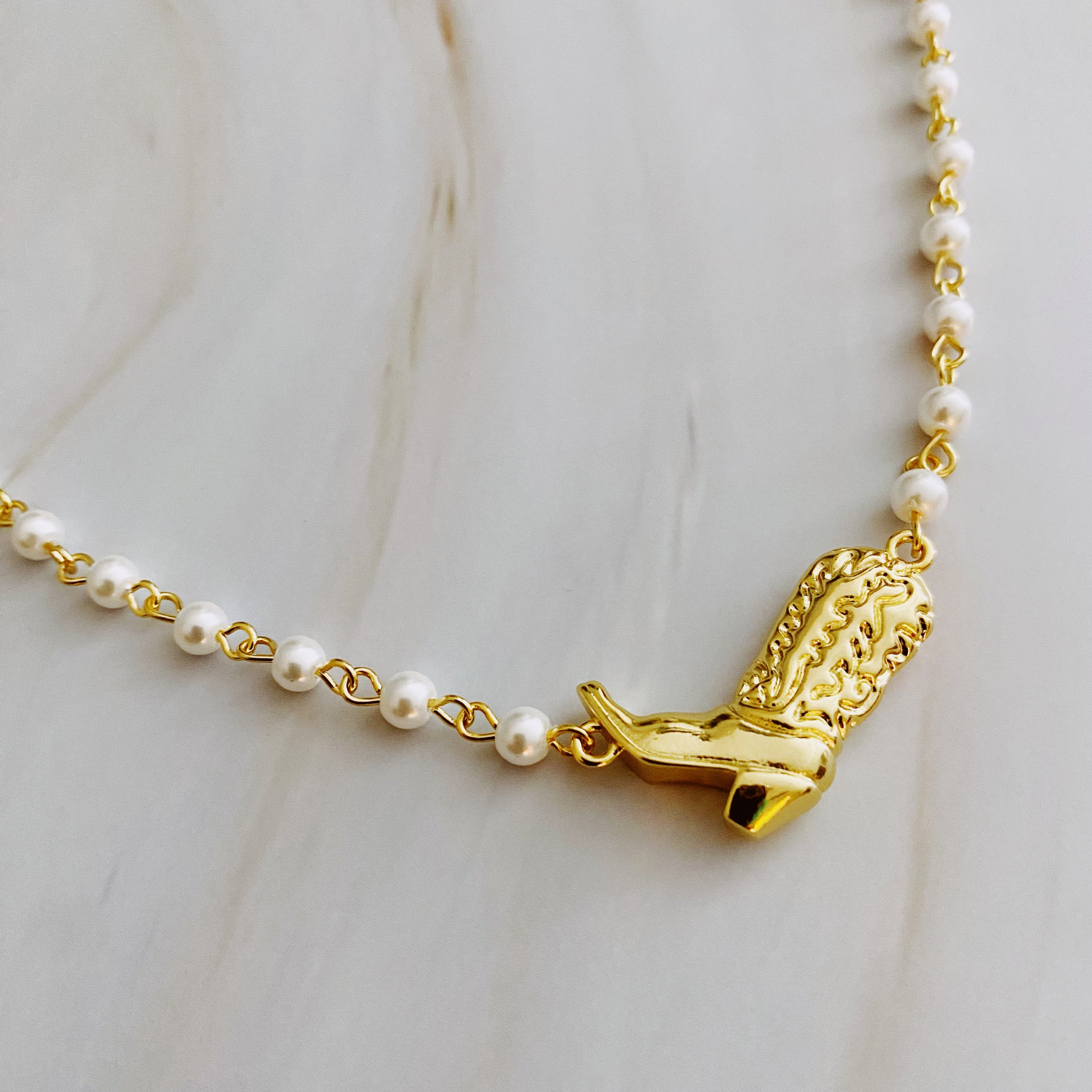 Cowgirl Boot Pearl Chain Necklace featuring a stylish boot pendant and elegant pearl chain, perfect for layering or wearing alone.