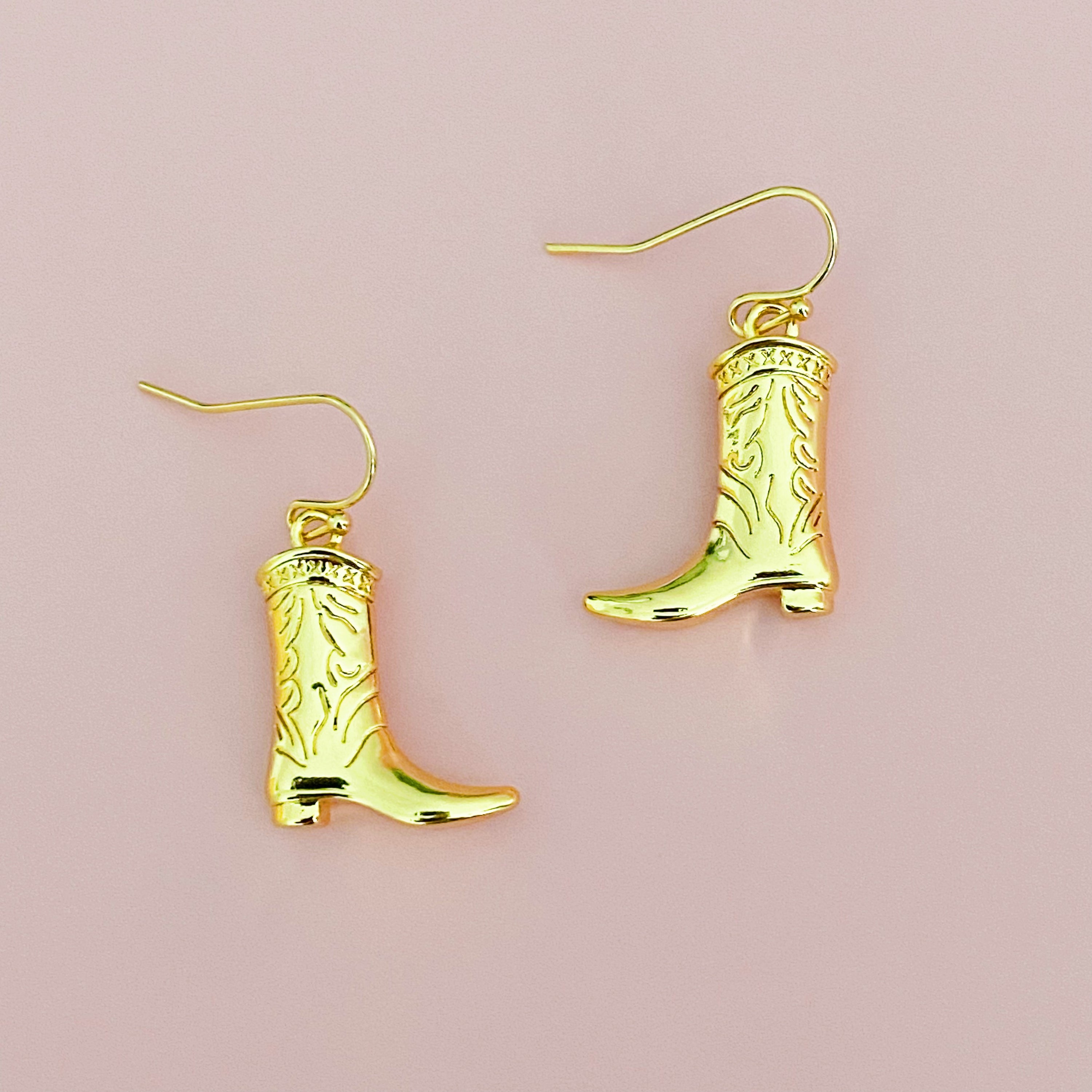 A pair of stylish Cowgirl Bootie Dangle Earrings featuring detailed boot charms on fishhook design, perfect for western-inspired fashion.