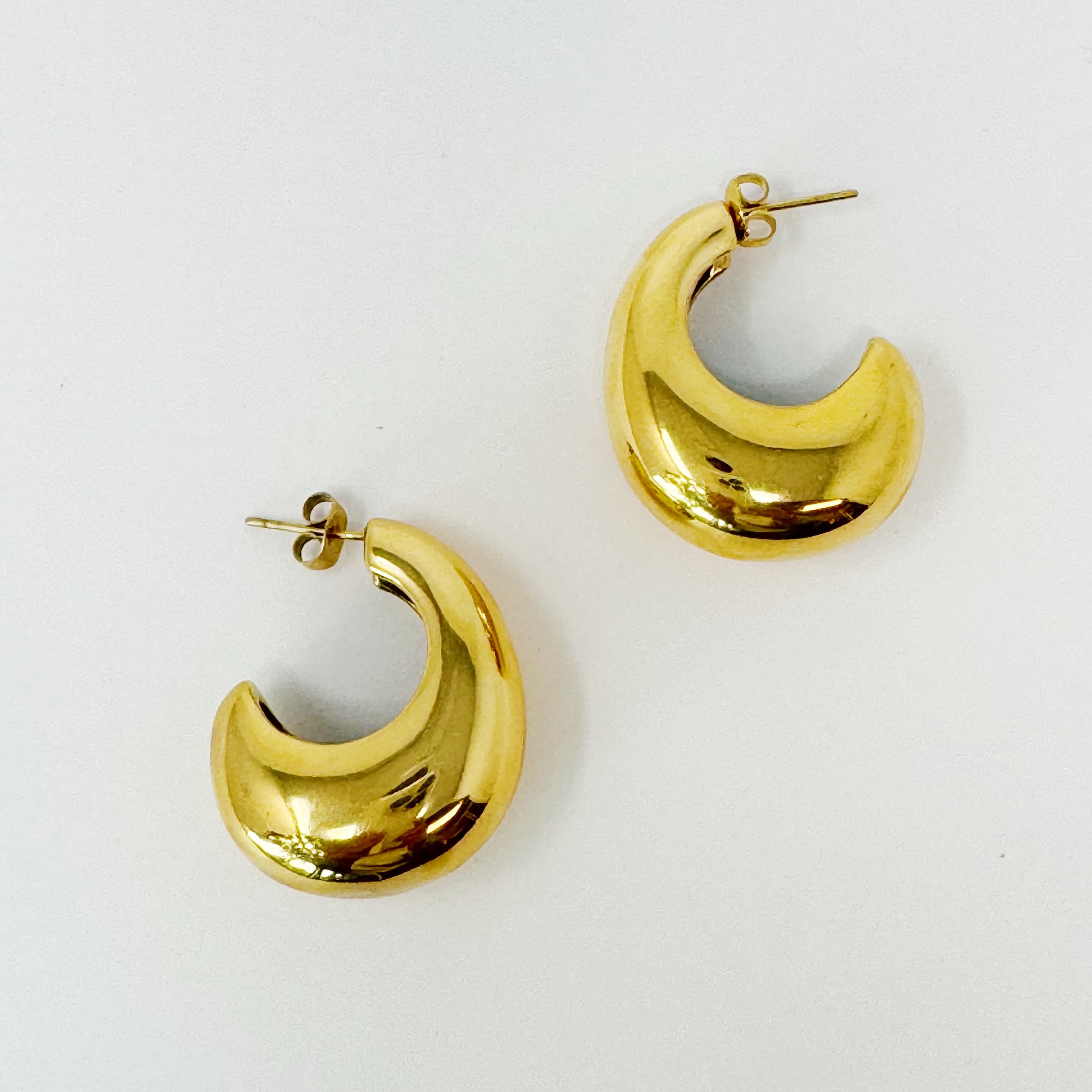 Crescent Halo Golden Hoop Earrings showcasing a unique crescent shape design in 18k gold plated stainless steel.
