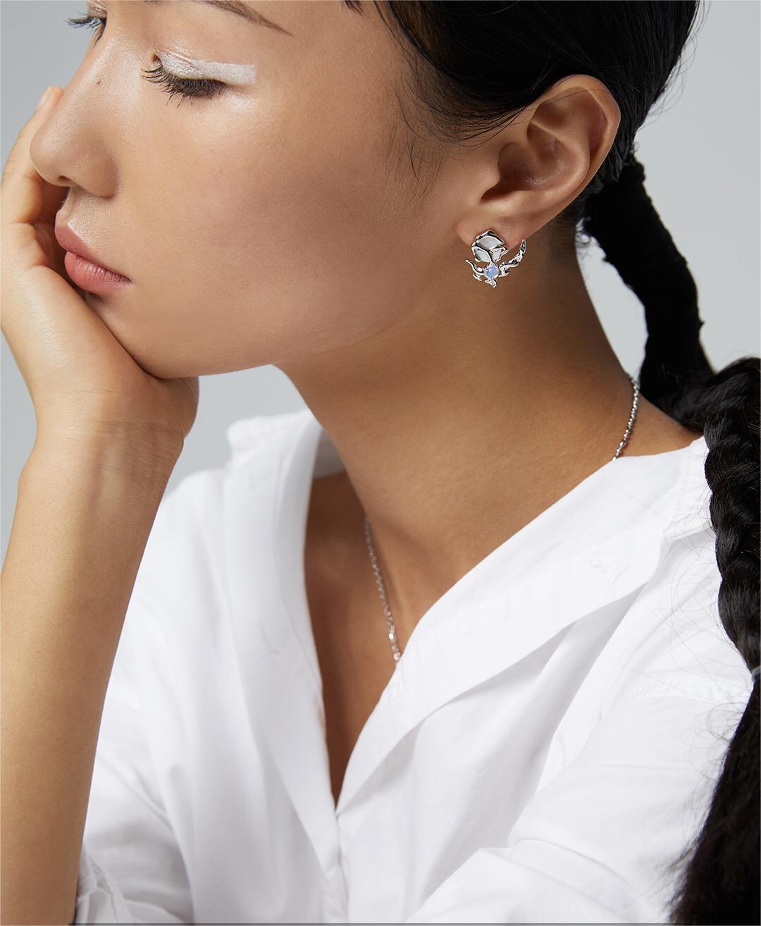 Crescent Moon Style Asymmetrical Opal Stud Earrings featuring opal and mother of pearl, set in sterling silver and gold vermeil.