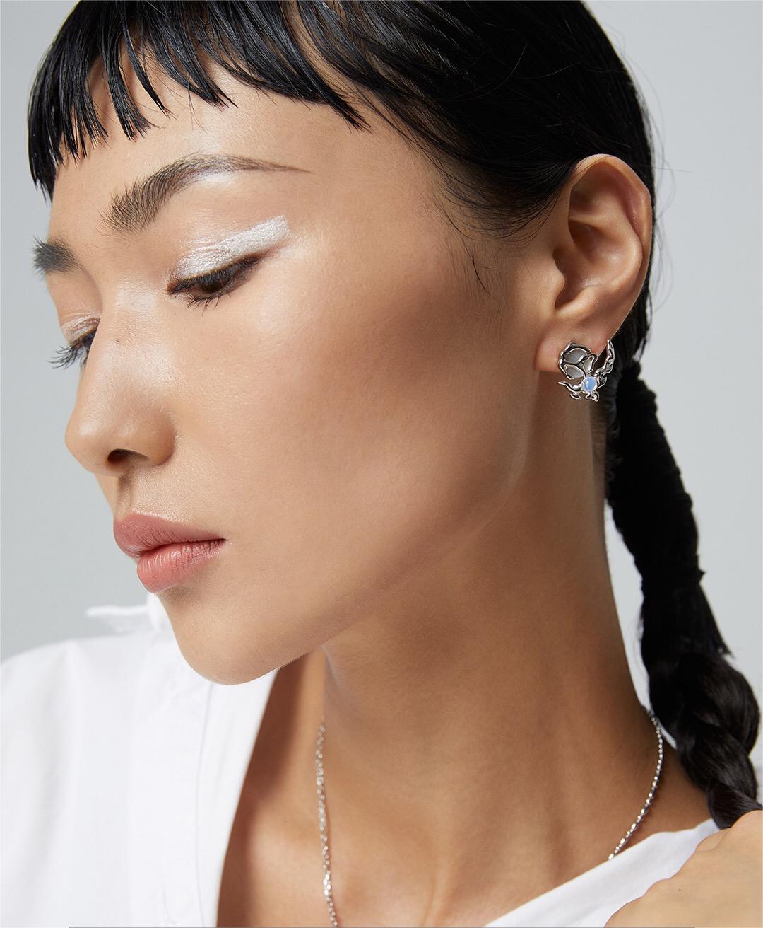 Crescent Moon Style Asymmetrical Opal Stud Earrings featuring opal and mother of pearl, set in sterling silver and gold vermeil.