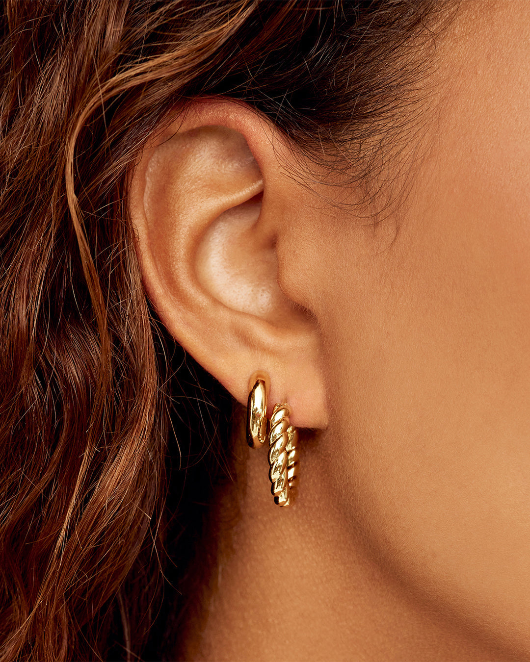 A pair of elegant Crew Hoop Set Earrings showcasing a sleek design, perfect for everyday wear.