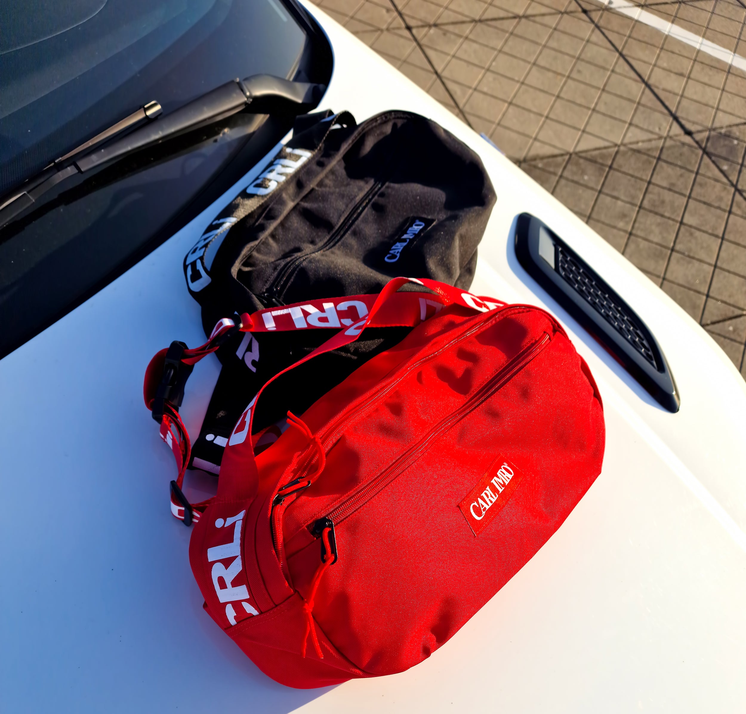 CRLi Cross LT outdoor sports bag in black and red, made from recycled nylon fabric, showcasing its stylish design and durable construction.