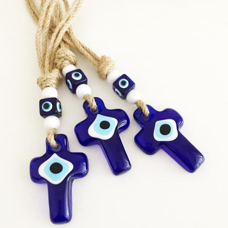 Handmade Cross Evil Eye Wall Hanging featuring small evil eye beads and a glass cross charm, perfect for home decor.