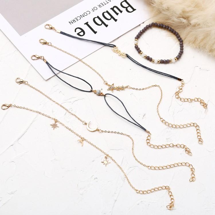 Crystal Celestial Marble 6 Piece Bracelet Set featuring 14K gold plating, black marble design, and celestial pendant with white crystals.