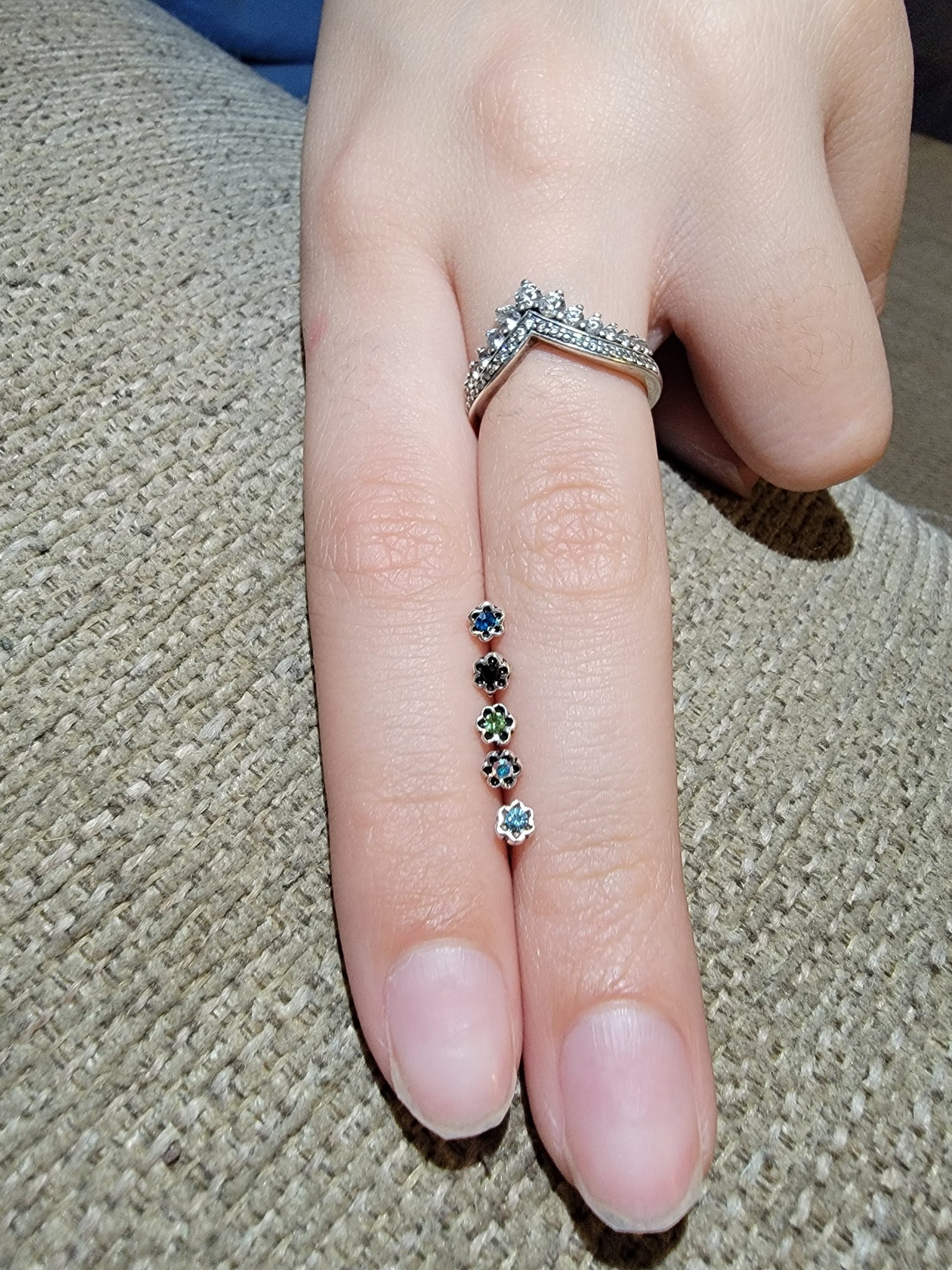 A sparkling crystal flower nose bone made of 20 gauge sterling silver with CZ crystals.