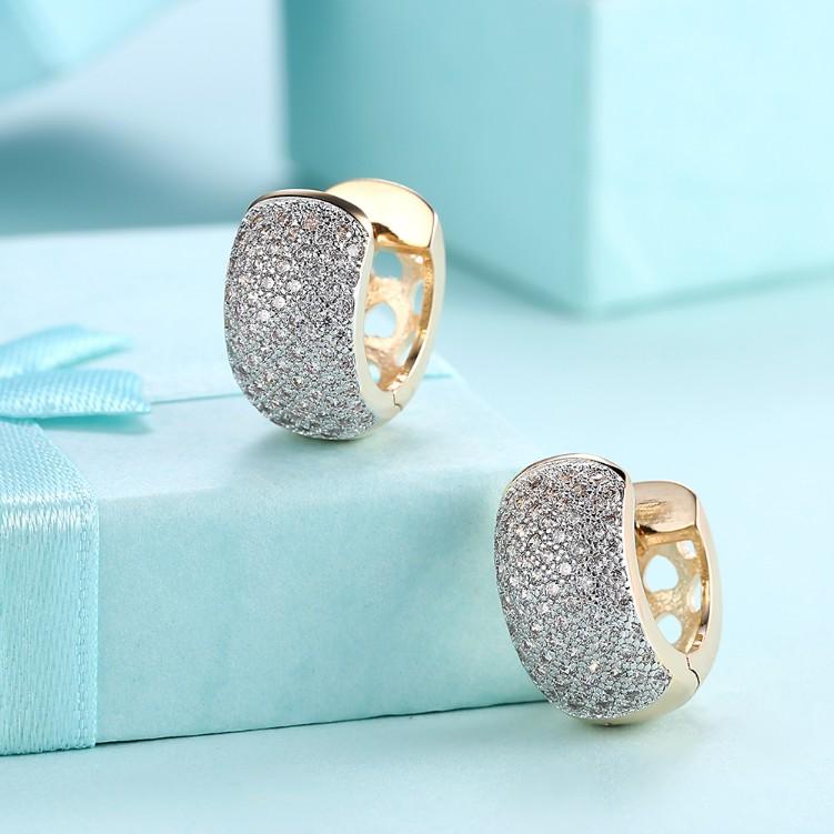 A pair of elegant Crystal Micro Pav'e Thick Cut Round Huggies earrings set in 18K gold, showcasing sparkling crystals and a butterfly backing.