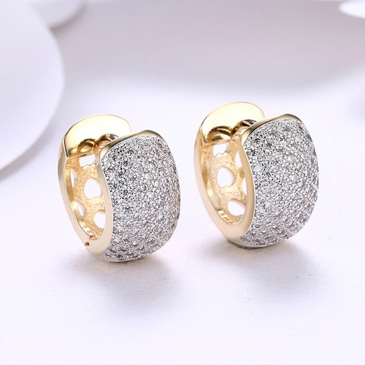 A pair of elegant Crystal Micro Pav'e Thick Cut Round Huggies earrings set in 18K gold, showcasing sparkling crystals and a butterfly backing.