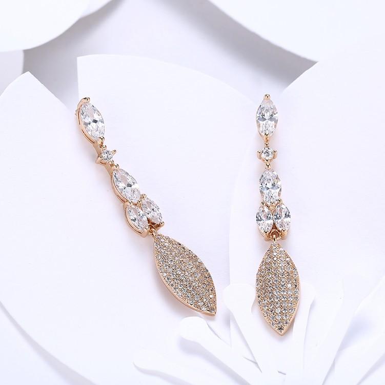 Elegant Crystal Micro-Pav'e Dangling Pear Shaped Earrings in 18K Gold, showcasing intricate detailing and sparkling crystals.