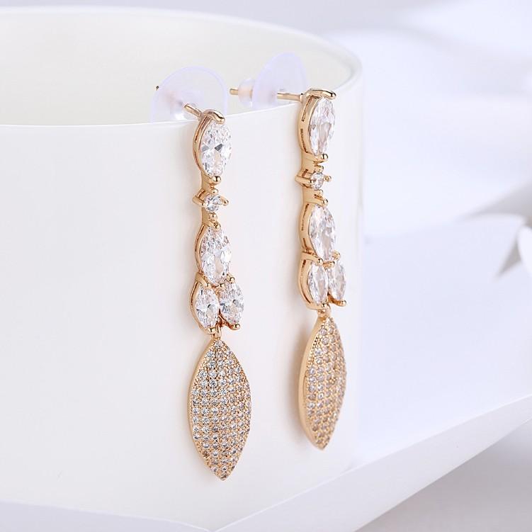 Elegant Crystal Micro-Pav'e Dangling Pear Shaped Earrings in 18K Gold, showcasing intricate detailing and sparkling crystals.