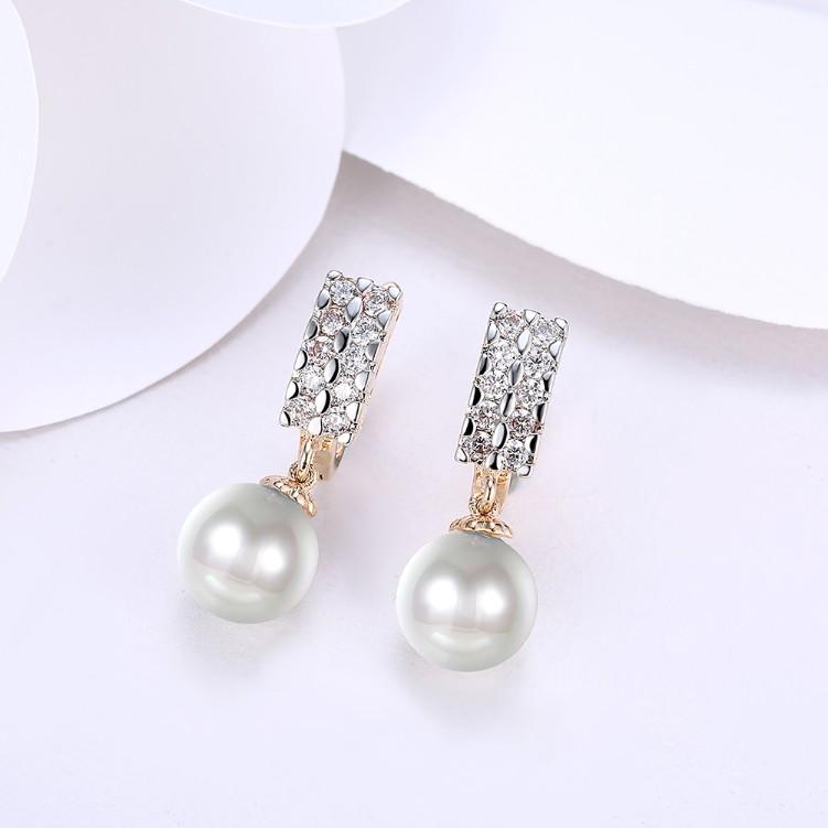 Elegant Crystal Square Shaped Pearl Leverback Earrings set in 18K gold, showcasing their stunning design and craftsmanship.