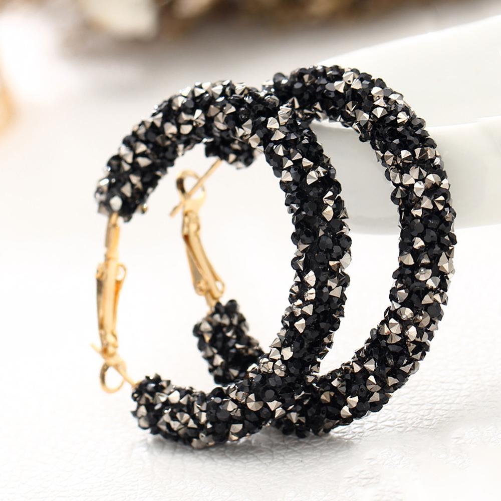Elegant Crystaldust Hoop Earring featuring gemstone crystals, crafted in black 18K gold plating, showcasing a luxurious design.