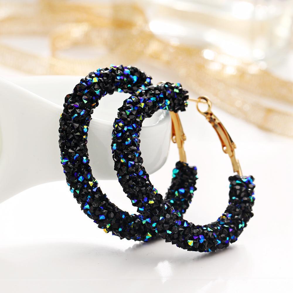 Elegant Crystaldust Hoop Earring with blue gemstone crystals, featuring a luxurious 18K gold plating, designed for comfort and durability.