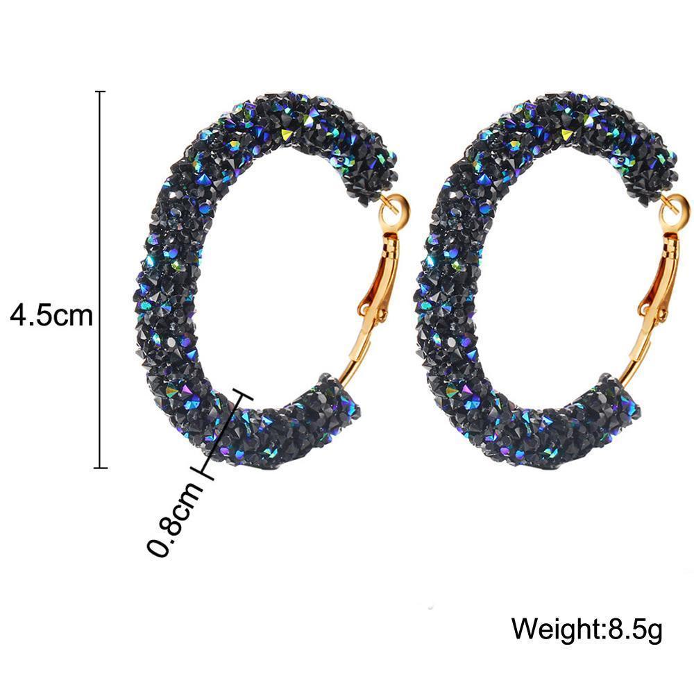 Elegant Crystaldust Hoop Earring with blue gemstone crystals, featuring a luxurious 18K gold plating, designed for comfort and durability.