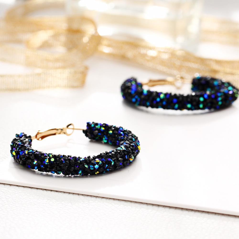 Elegant Crystaldust Hoop Earring with blue gemstone crystals, featuring a luxurious 18K gold plating, designed for comfort and durability.