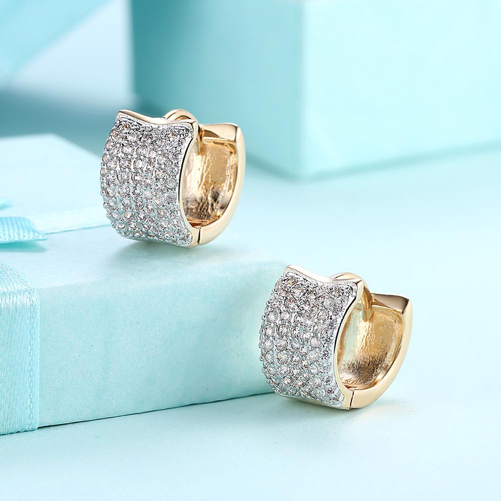 Elegant 15mm Pave Huggie Earrings featuring sparkling crystals and gold plating, designed for comfort and hypoallergenic wear.
