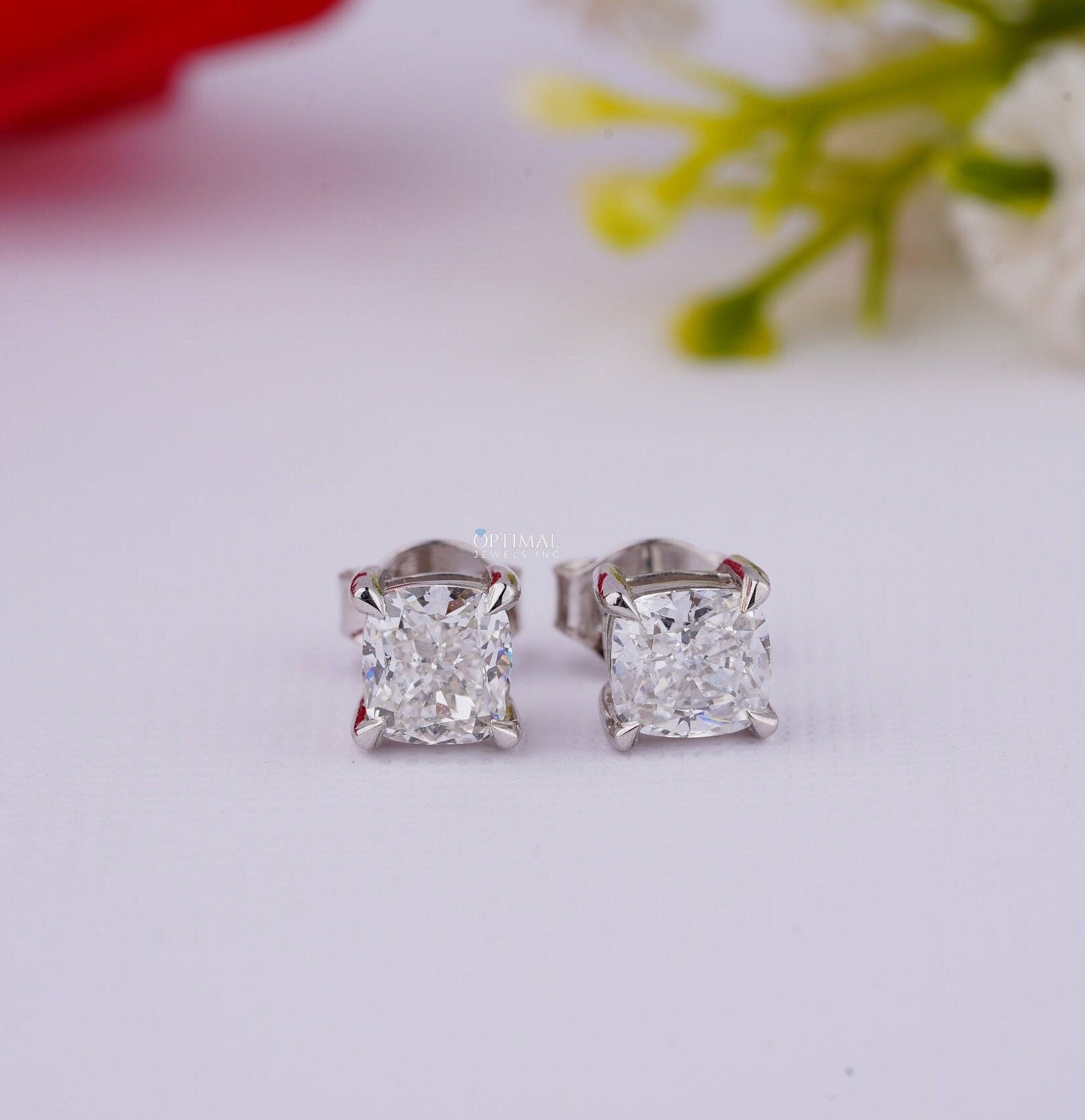 Cushion Cut Diamond Stud Earrings in white gold featuring lab-grown diamonds, elegantly designed for engagement or gifting.