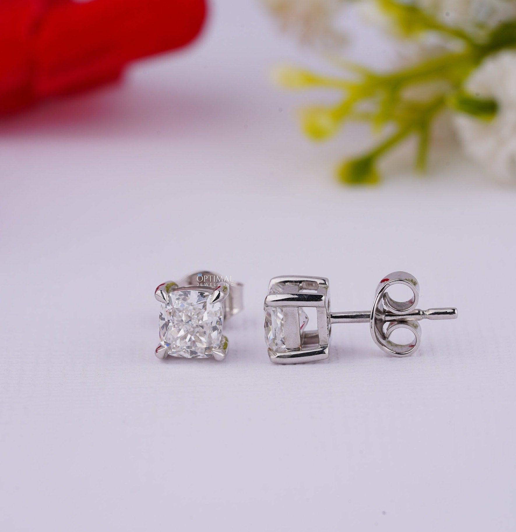 Cushion Cut Diamond Stud Earrings in white gold featuring lab-grown diamonds, elegantly designed for engagement or gifting.