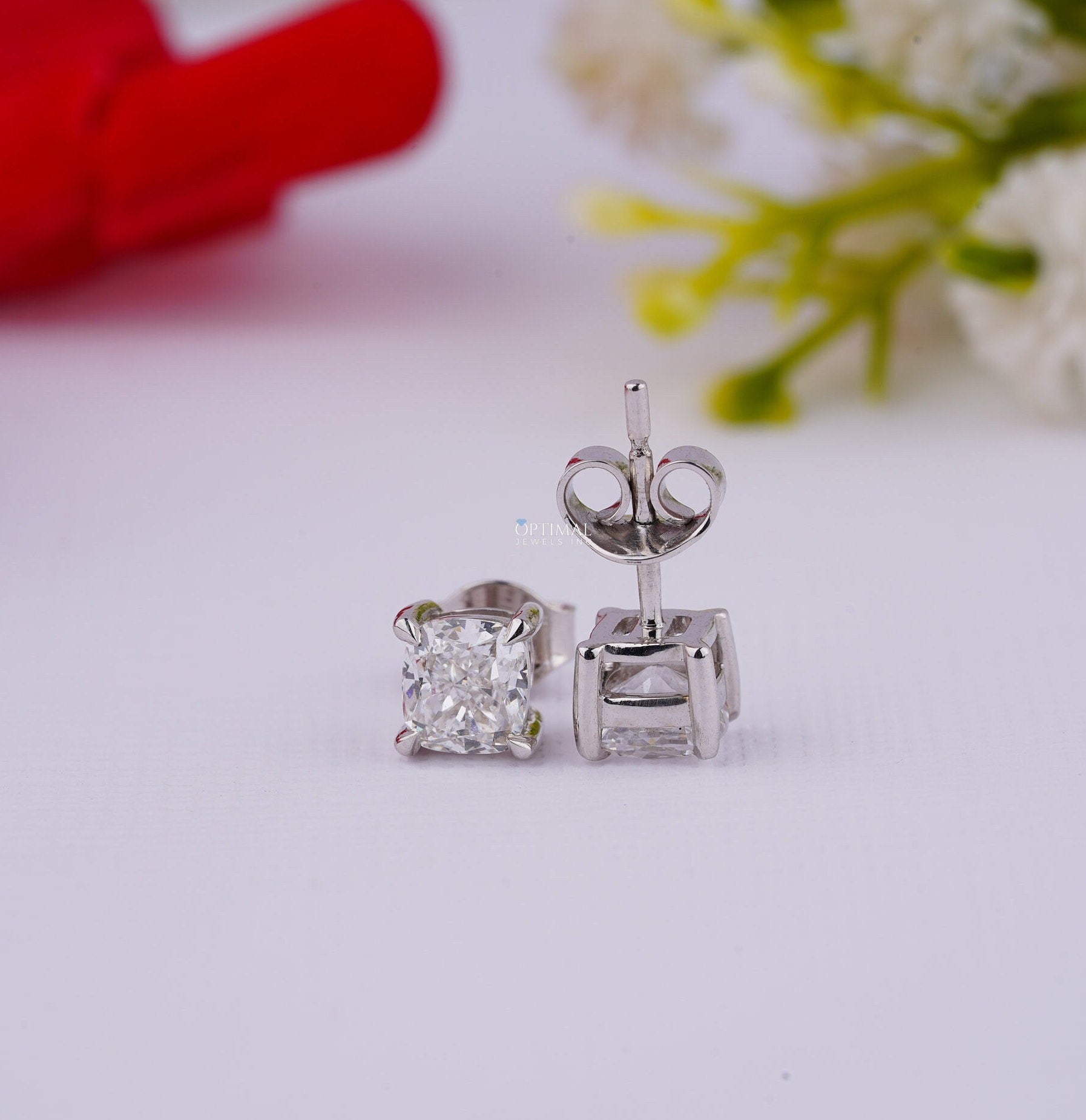 Cushion Cut Diamond Stud Earrings in white gold featuring lab-grown diamonds, elegantly designed for engagement or gifting.